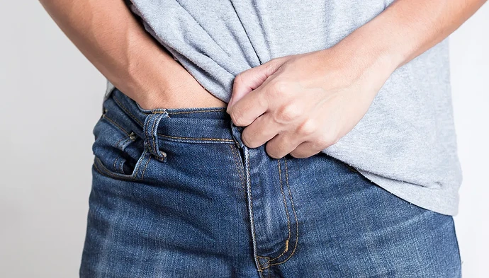 man-hand-down-pants